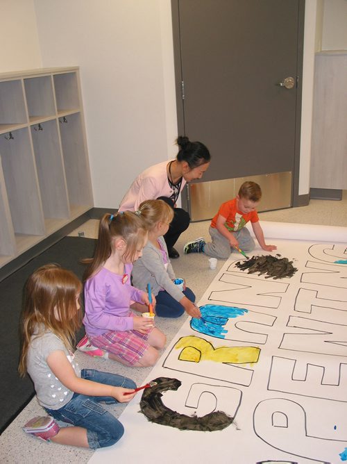 Canstar Community News June 5, 2018 - Director Lidan Xu watches children at the new La Salle KIDZ Daycare Centre who were painting signs for the centre's grand opening on June 9. (ANDREA GEARY/CANSTAR COMMUNITY NEWS)