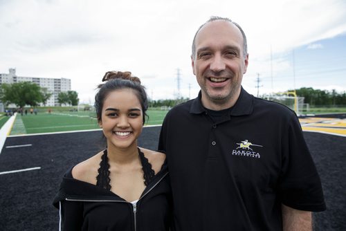 MIKE DEAL / WINNIPEG FREE PRESS
Student Safia Mohamed, 17, and Dean Favoni, a teacher who for the past 25 years has been leading a team of student volunteers who take care of runners at the finish line. They are the huggers who help runners needing assistance. This year around 180 students from Dakota Collegiate have signed up to take care of the runners at the finish line.
180612 - Tuesday, June 12, 2018.