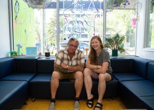 ANDREW RYAN / WINNIPEG FREE PRESS Brent Mitchell, left, and Sarah Thiessen sit for a portrait at Art City. Both are volunteers at the drop in youth art program on Broadway.