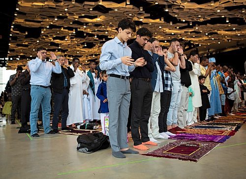 ANDREW RYAN / WINNIPEG FREE PRESS Bashir Taguir prays facing Mecca during the Eid-ul-Fitr, the last day of Ramadan, at the RBC Convention centre on June 15, 2018.