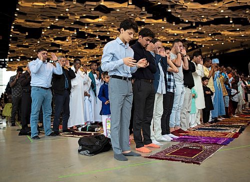 ANDREW RYAN / WINNIPEG FREE PRESS Bashir Taguir prays facing Mecca during the Eid-ul-Fitr, the last day of Ramadan, at the RBC Convention centre on June 15, 2018.
