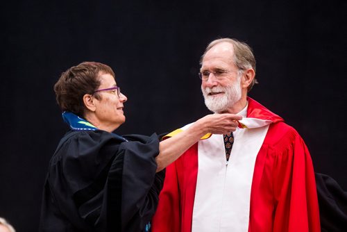 MIKAELA MACKENZIE / WINNIPEG FREE PRESS
Annette Trimbee gives Peter Agre an honorary doctor of science at the University of Winnipegs  2018 Spring Convocation ceremonies at the Duckworth Centre in Winnipeg on Friday, June 15, 2018. 
Mikaela MacKenzie / Winnipeg Free Press 2018.