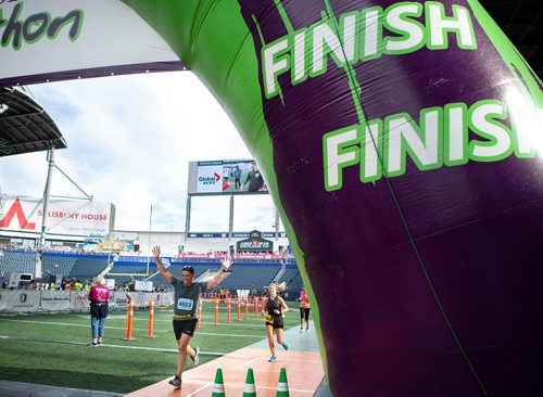 ANDREW RYAN / WINNIPEG FREE PRESS Ruben Levi crosses the finish line of the Manitoba half marathon on June 17, 2018.