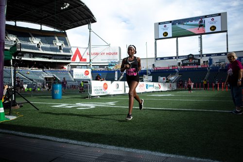 ANDREW RYAN / WINNIPEG FREE PRESS Hailey Rice crosses the fines of the 10 km at the Manitoba marathon at Investors Group Stadium, June 17, 2018.