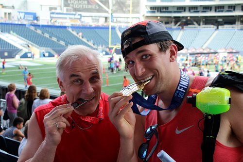 MAGGIE MACINTOSH / WINNIPEG FREE PRESS
Dylan Bronk, right, is the third generation Bronk to cross the finish line of the 42 km Manitoba Marathon. His dad, Bob Bronk, left, and grandfather (not pictured) ran in the inaugural event in 1979. June 17, 2018