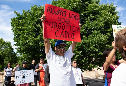 ANDREW RYAN / WINNIPEG FREE PRESS A man holds a sign remembering a lost loved one at a gathering to raise awareness missing and murdered indigenous men on June 17, 2018.