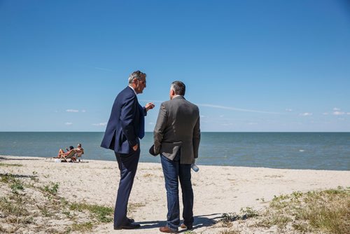 MIKE DEAL / WINNIPEG FREE PRESS
Premier Brian Pallister and MP James Bezan take a moment to talk after the announcement.
Premier Brian Pallister and Jim Carr, Federal Minister of Natural Resources Canada, announced a $540 million infrastructure project for flood management of the Lake Manitoba and Lake St. Martin outlet channels at an event at Parc Gros Arbre, off Allard Road close to St. Laurent, Manitoba, Monday morning.
180618 - Monday, June 18, 2018.