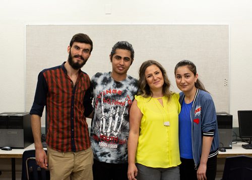 ANDREW RYAN / WINNIPEG FREE PRESS Megan Sodomsky, third from left, is a volunteer English as an Additional Language (EAL) instructor who has helped these three Yazidi refugees adapt to Canadian life. From left is Diyar Salih , Amin Murad, Megan Sodomsky and Aida Naso at Grant Park High School on June 19, 2018.