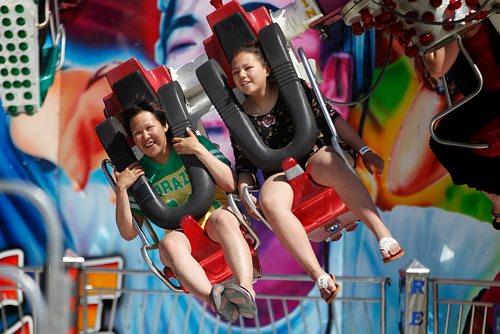 PHIL HOSSACK / WINNIPEG FREE PRESS - Red RIver Ex patrons enjoy the sun and the rides Tuesday afternoon. See Maggie Macintosh's story.- June 19, 2018