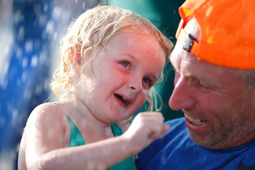 JOHN WOODS / WINNIPEG FREE PRESS
Kirsten Davis, 3 cools down as she plays in a water spray station with her grandpa Rick Gerbrandt at The Ex in Winnipeg Tuesday, June 19, 2018. The Ex is expecting great weather this year and even better attendance.