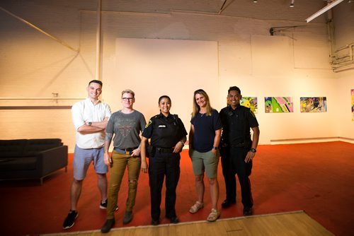 MIKAELA MACKENZIE / WINNIPEG FREE PRESS
Police Brian Hunter (left), Tracy Patterson, Maria Buduhan, Shaunna Neufeld, and Orlando Buduhan pose at the Graffiti Gallery in Winnipeg on Thursday, June 21, 2018. Graffiti Gallery's new exhibit, Intersections, is opening soon showcasing the work created in partnership with Graffiti Art Programming and the Winnipeg Police Service.
Mikaela MacKenzie / Winnipeg Free Press 2018.