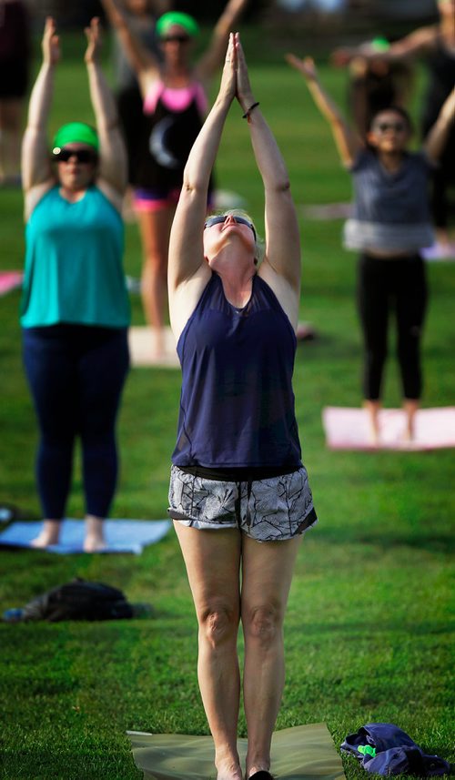 PHIL HOSSACK / WINNIPEG FREE PRESS -  About 300 yogis descended on the Lyric Stage at Assinaboine Park Thursday evening in recognition of International Yoga Day. +30C temperatures turned the event into an outdoor Hot Yoga flow class. See release. - June 21, 2018