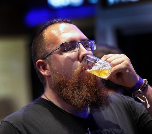 PHIL HOSSACK / WINNIPEG FREE PRESS - FLATLANDERS BEER FESTIVAL....Big man Tiny Cup.....Thousands of "patrons" filled the MTS Centre Friday evening for the Annual festival of beers. toting tiny steins they went from vendor to vendor for free samples. See release.  - June 22, 2018