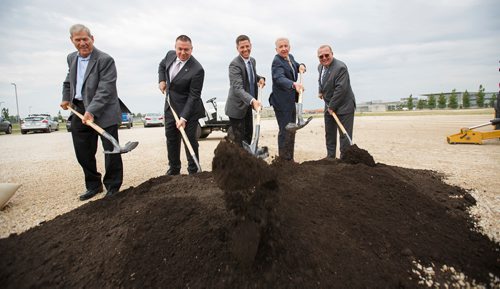 MIKE DEAL / WINNIPEG FREE PRESS
(from left) Don Snodgrass president of construction firm Con-Pro, Pascal Bélanger VP and Chief Commercial Officer at Winnipeg Airports Authority, Winnipeg Mayor Brian Bowman, Barry Rempel CEO of the WAA and Ralph Eichler Manitoba Minister of Agriculture, were on hand during the ground breaking celebration for the Winnipeg Airports Authority's new $27 million Ground Services Equipment Building at the Winnipeg Richardson International Airport Monday morning.
180625 - Monday, June 25, 2018.