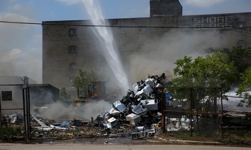 MIKE DEAL / WINNIPEG FREE PRESS
Winnipeg Fire Paramedic Service crews work on putting out a fire in the yard of Orloff Scrap Metals located at King Street and Sutherland Avenue.
180625 - Monday, June 25, 2018.
