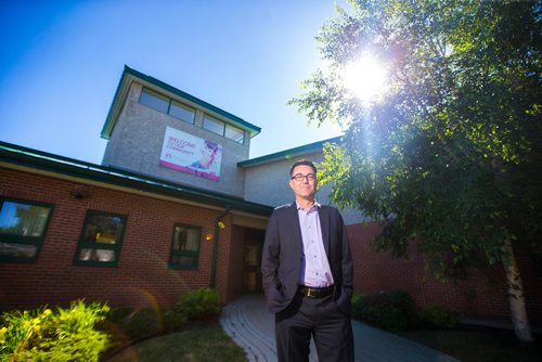 MIKAELA MACKENZIE / WINNIPEG FREE PRESS
Brad Collett, CAO for City of Dauphin, poses in front of the Dauphin City Hall on Wednesday, June 27, 2018. The first thing Eric did as mayor was put the banner that reads "welcome to our community" up.
Mikaela MacKenzie / Winnipeg Free Press 2018.