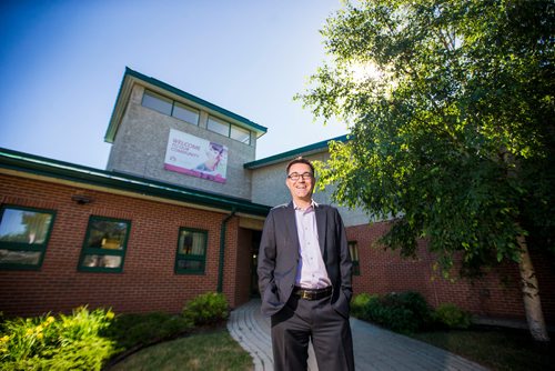 MIKAELA MACKENZIE / WINNIPEG FREE PRESS
Brad Collett, CAO for City of Dauphin, poses in front of the Dauphin City Hall on Wednesday, June 27, 2018. The first thing Eric did as mayor was put the banner that reads "welcome to our community" up.
Mikaela MacKenzie / Winnipeg Free Press 2018.