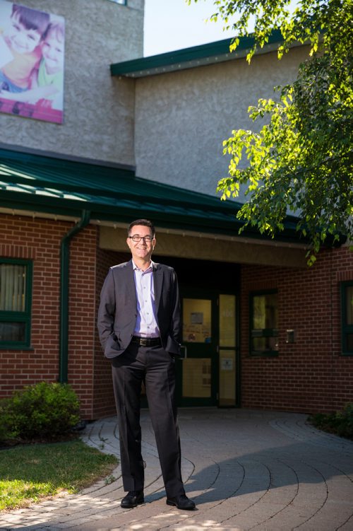 MIKAELA MACKENZIE / WINNIPEG FREE PRESS
Brad Collett, CAO for City of Dauphin, poses in front of the Dauphin City Hall on Wednesday, June 27, 2018. The first thing Eric did as mayor was put the banner that reads "welcome to our community" up.
Mikaela MacKenzie / Winnipeg Free Press 2018.