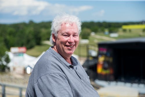 MIKAELA MACKENZIE / WINNIPEG FREE PRESS
Rob Woloschuk, general manager of Countryfest, poses in the bleachers in front of the main festival stage outside of Dauphin on Wednesday, June 27, 2018.
Mikaela MacKenzie / Winnipeg Free Press 2018.