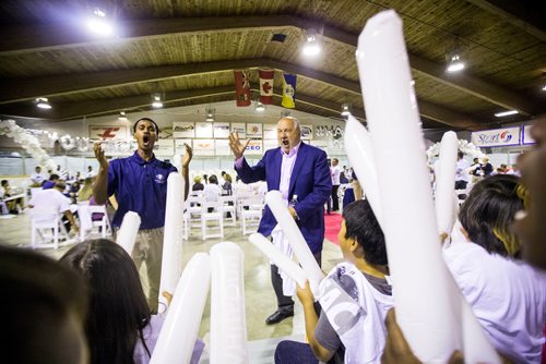 MIKAELA MACKENZIE / WINNIPEG FREE PRESS
Intern Maeron Meresi (left) and executive chairman of Bison Transport Don Streuber rile their section up as the Business Council of Manitoba kicks off Youth CEO summer internship program at the Old Exhibition Arena in Winnipeg on Thursday, June 28, 2018.
Mikaela MacKenzie / Winnipeg Free Press 2018.