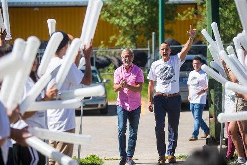 MIKAELA MACKENZIE / WINNIPEG FREE PRESS
Bob Silver, co-owner of the Winnipeg Free Press (left),  and Kevin Chief walk through a crowd of cheering kids as the Business Council of Manitoba kicks off Youth CEO summer internship program at the Old Exhibition Arena in Winnipeg on Thursday, June 28, 2018.
Mikaela MacKenzie / Winnipeg Free Press 2018.