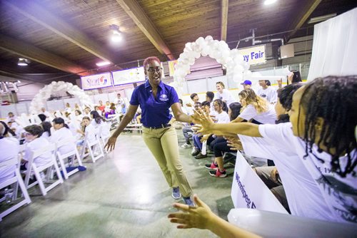 MIKAELA MACKENZIE / WINNIPEG FREE PRESS
Intern Niyokei Munroe high-fives kids on her run up to the stage after being chosen by National Leasing  in the Youth CEO summer internship program at the Old Exhibition Arena in Winnipeg on Thursday, June 28, 2018.
Mikaela MacKenzie / Winnipeg Free Press 2018.