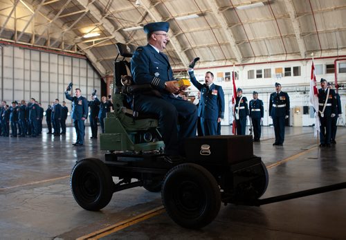 ANDREW RYAN / WINNIPEG FREE PRESS Outgoing Commander Colonel Andy Cook is escorted out in a ceremonial flight seat while the parade shouts good bye, ending the 17 Wing change of Command on June 28, 2018.