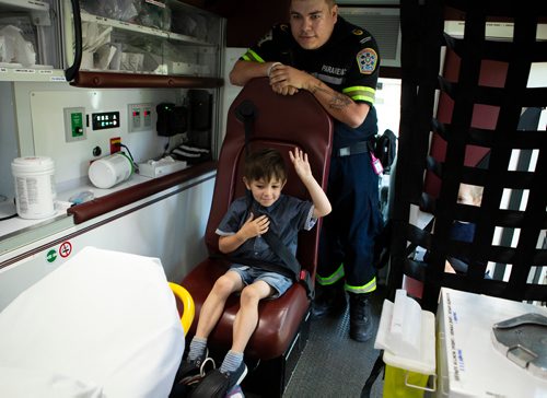 ANDREW RYAN / WINNIPEG FREE PRESS
Ryder Robinson tours a paramedic van with paramedic Layne Berens during a media event for the Sirens for Hope campaign at Memorial Park June 28, 2018. Robinson was diagnosed with Leukaemia at eight months old and required donated blood until he was two-and-a-half years old.