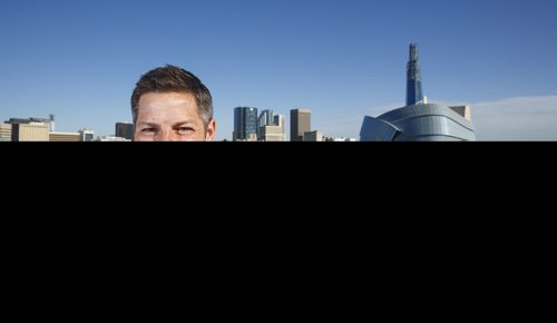 MIKE DEAL / WINNIPEG FREE PRESS
Winnipeg Mayor Brian Bowman on the roof of The Inn at The Forks with the skyline of the city behind him.
180628 - Thursday, June 28, 2018.