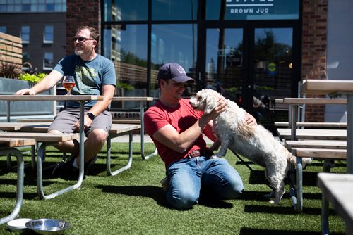 ANDREW RYAN / WINNIPEG FREE PRESS Kevin Selch,  owner of Little Brown Jug,  and his dog Penny on the pet friendly patio at the Winnipeg micro brewery, on June 28, 2018.