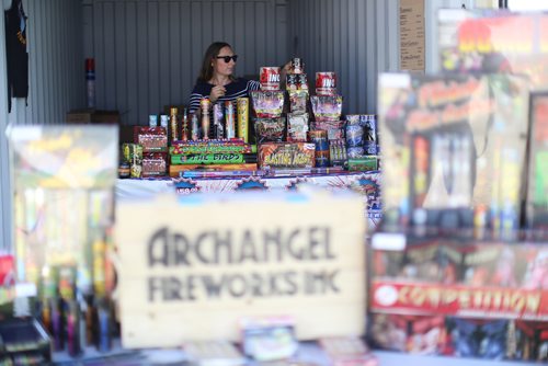 TREVOR HAGAN / WINNIPEG FREE PRESS
Tammy Stelmachowich sells fireworks for Archangel Fireworks out of a popup stand near the corner of St.Annes and the Perimeter, Friday, June 29, 2018.