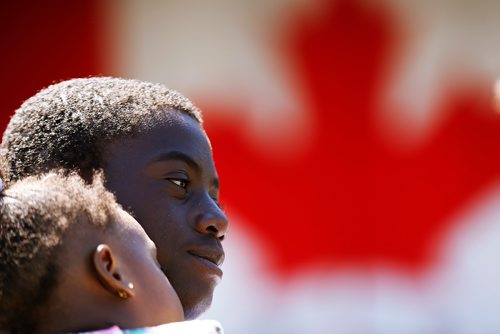 JOHN WOODS / WINNIPEG FREE PRESS
Valentine Adedeji holds his young sister Debra prior to his citizenship ceremony on  Canada Day at Assiniboine Park, Sunday, July 1, 2018.