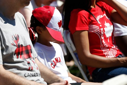 JOHN WOODS / WINNIPEG FREE PRESS
A child takes a break from the sunshine during a citizenship ceremony on  Canada Day at Assiniboine Park, Sunday, July 1, 2018.