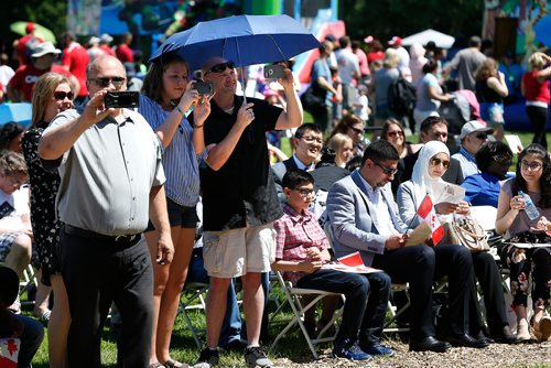 JOHN WOODS / WINNIPEG FREE PRESS
People take photos during a citizenship ceremony on  Canada Day at Assiniboine Park, Sunday, July 1, 2018.