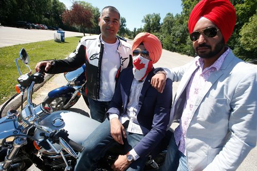 JOHN WOODS / WINNIPEG FREE PRESS
From left, Ray Kumar, Simranjeet Sidhu rode their bikes to the citizenship ceremony to support their friend Jasbreet Singh Sangha as he received his citizenship on Canada Day at Assiniboine Park, Sunday, July 1, 2018.