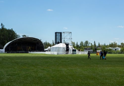 ANDREW RYAN / WINNIPEG FREE PRESS Volunteers walk across the field in front of the main stage the day before Manitoba music festival, Folkfest, which kicks off at Birds Hill Park on July 5, 2018.