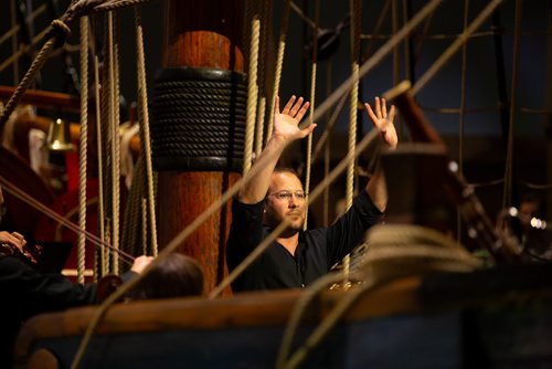 ANDREW RYAN / WINNIPEG FREE PRESS The Winnipeg Symphony Orchestra conductor Julian Pellicano, directs a concert consisting of music related to water, by great composers such as George Frideric Handel, on the Nonsuch replica at the Manitoba Museum on July 4, 2018.