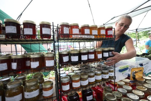 RUTH BONNEVILLE / WINNIPEG FREE PRESS

Trudy Penner adjusts jams on her shelves at her vendors booth at the downtown farmers' market at Hydro Place on Thursday.
For story on the new tariffs that are on products, like jam, from the US.

See Ben Waldman story. 

July 05, 2018
