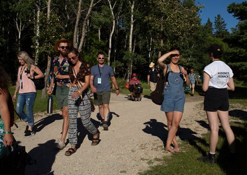 ANDREW RYAN / WINNIPEG FREE PRESS Festival goers walk towards the MainStage to welcome first performer Roger Roger who kicks off Folk Fest on July 5, 2018.
