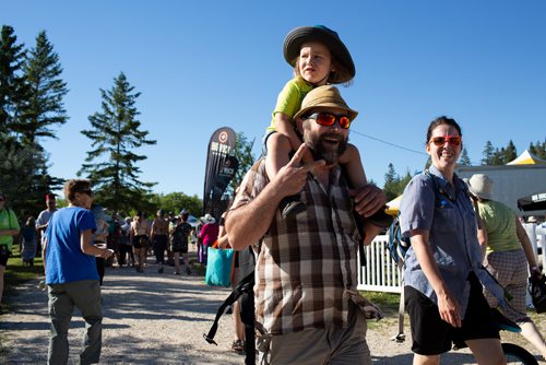 ANDREW RYAN / WINNIPEG FREE PRESS Festival goers walk towards the MainStage to welcome first performer Roger Roger who kicks off Folk Fest on July 5, 2018.