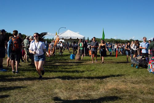 ANDREW RYAN / WINNIPEG FREE PRESS Festival goers line up to enter the festival and welcome first performer Roger Roger who kicks off Folk Fest on July 5, 2018.