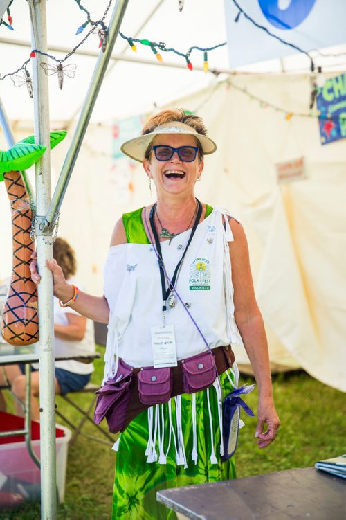 MIKAELA MACKENZIE / WINNIPEG FREE PRESS
Donna Mills, volunteer at the InfOasis, at the information point's tent at the Winnipeg Folk Fest in Bird's Hill Provincial Park on Friday, July 6, 2018. 
Mikaela MacKenzie / Winnipeg Free Press 2018.