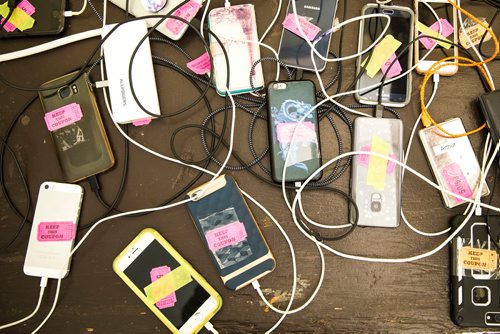 MIKAELA MACKENZIE / WINNIPEG FREE PRESS
The cell phone charging station at the InfOasis tent at the Winnipeg Folk Fest in Bird's Hill Provincial Park on Friday, July 6, 2018. 
Mikaela MacKenzie / Winnipeg Free Press 2018.