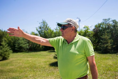 MIKAELA MACKENZIE / WINNIPEG FREE PRESS
Richard Hlady, former student at Melrose School, points out the old school field on Friday, July 6, 2018. 
Mikaela MacKenzie / Winnipeg Free Press 2018.