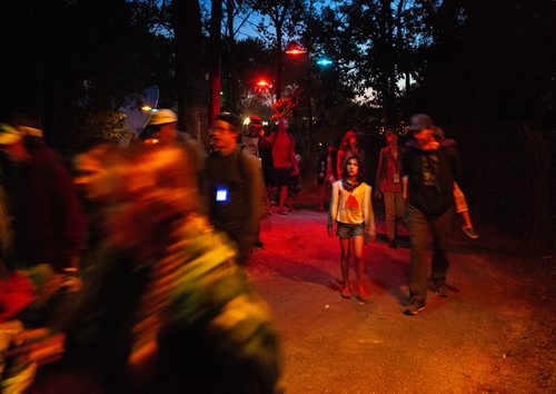 ANDREW RYAN / WINNIPEG FREE PRESS A girl pauses to enjoy the lights on the path out at Winnipeg Folk Fest in Birds Hill Provincial Park on July 5, 2018.