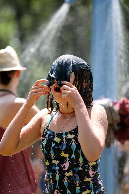 RUTH BONNEVILLE / WINNIPEG FREE PRESS


Ella Kowlowsky-Wiebe refreshes herself in the outdoor showers by soaking a cloth on her head while attending the Winnipeg Folk Fest with her family at Birds Hill Park Saturday.

July 07, 2018 
