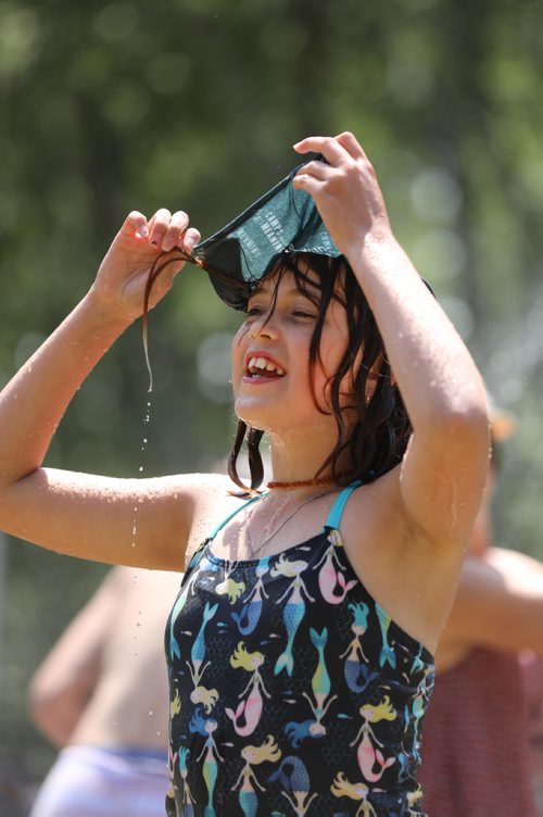 RUTH BONNEVILLE / WINNIPEG FREE PRESS


Ella Kowlowsky-Wiebe refreshes herself in the outdoor showers by soaking a cloth on her head while attending the Winnipeg Folk Fest with her family at Birds Hill Park Saturday.

July 07, 2018 
