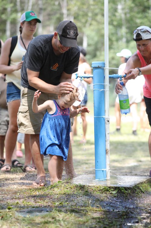 RUTH BONNEVILLE / WINNIPEG FREE PRESS


Ryan Klann cools his daughter Kira Klann (21/2yrs), at a water station while attending the Winnipeg Folk Fest at Birds Hill Park Saturday.

July 07, 2018 
