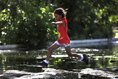 RUTH BONNEVILLE / WINNIPEG FREE PRESS


Seen Waites (7yrs),Aberdeen, Scotland, skips over rocks along a walking path over the Assiniboine Park Duck Pond while visiting the park with her family as they tour Winnipeg with relatives Monday.  

Standup photo 

July 09, 2018 
