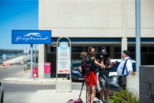 MIKAELA MACKENZIE / WINNIPEG FREE PRESS
Media talks to Frank Bruce in front of the Greyhound bus terminal at the Winnipeg airport on Monday, July 9, 2018. Greyhound is cutting all of their prairie services this October.
Mikaela MacKenzie / Winnipeg Free Press 2018.